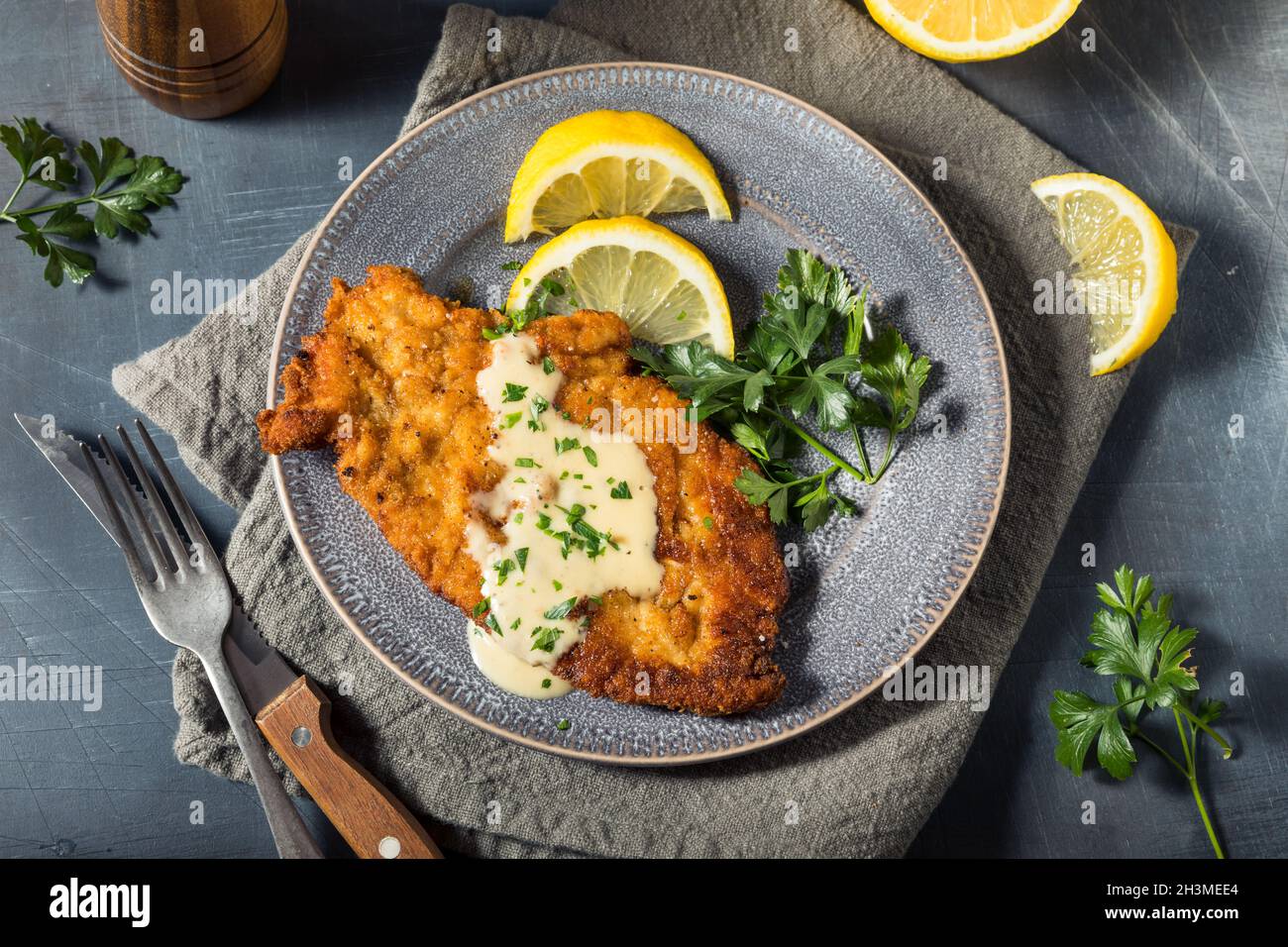 Homemade German Chicken Schnitzel with Lemon and Sauce Stock Photo Alamy