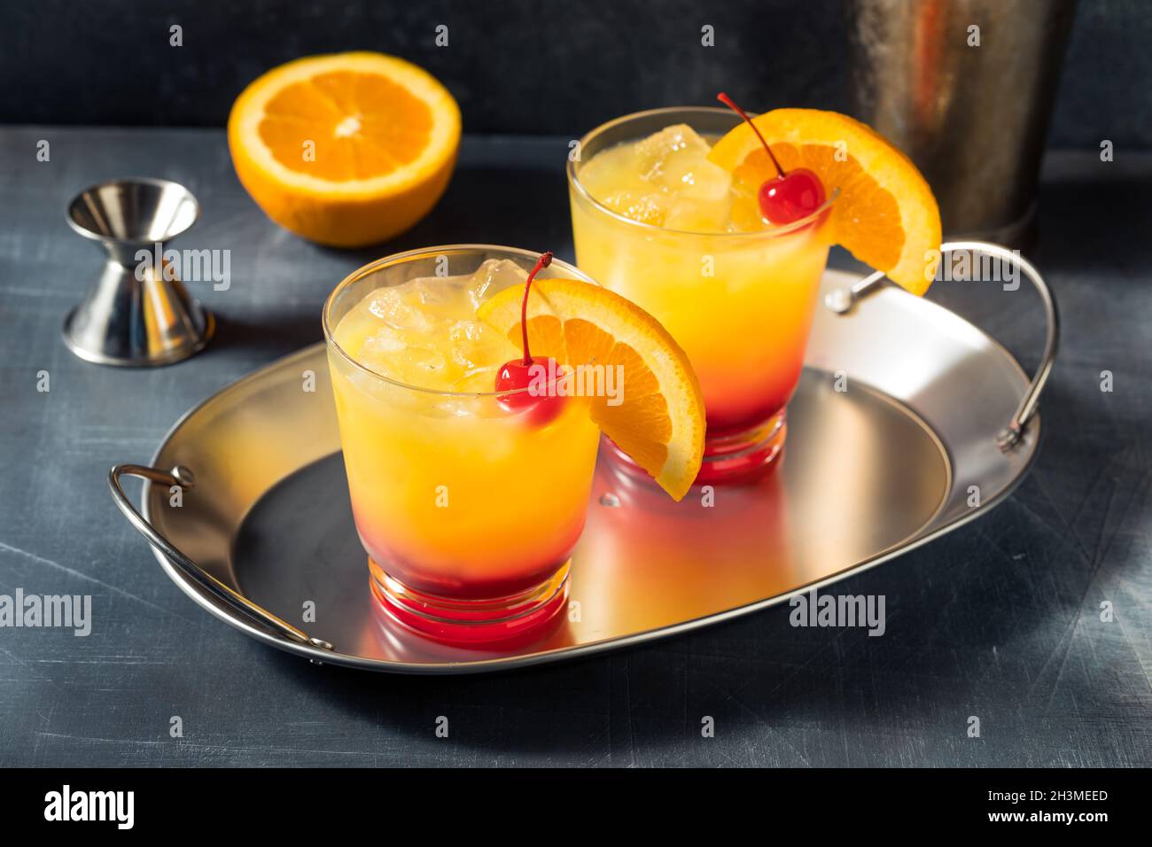Boozy Cold Tequila Sunrise Cocktail with Grenadine Stock Photo