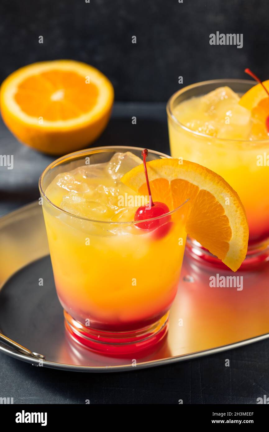 Boozy Cold Tequila Sunrise Cocktail with Grenadine Stock Photo