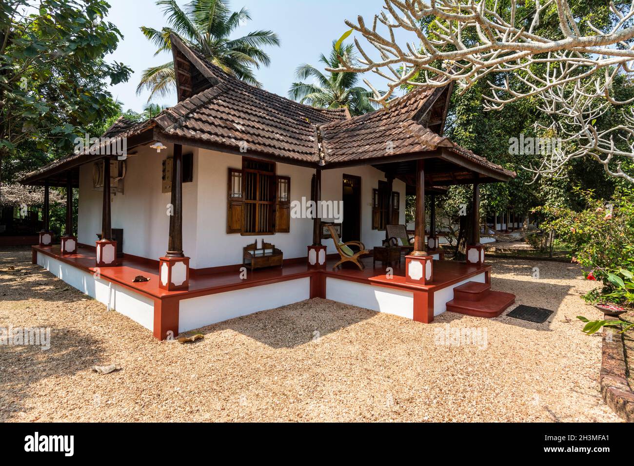 A luxury styled large guest bungalow with en-suite bathroom and furnished with Indian styled furnishings. It was the first building of the six when  Phili Stock Photo