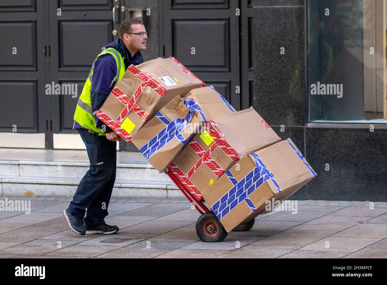 Delivery driver delivering parcels for Office store. Van loads for on ...