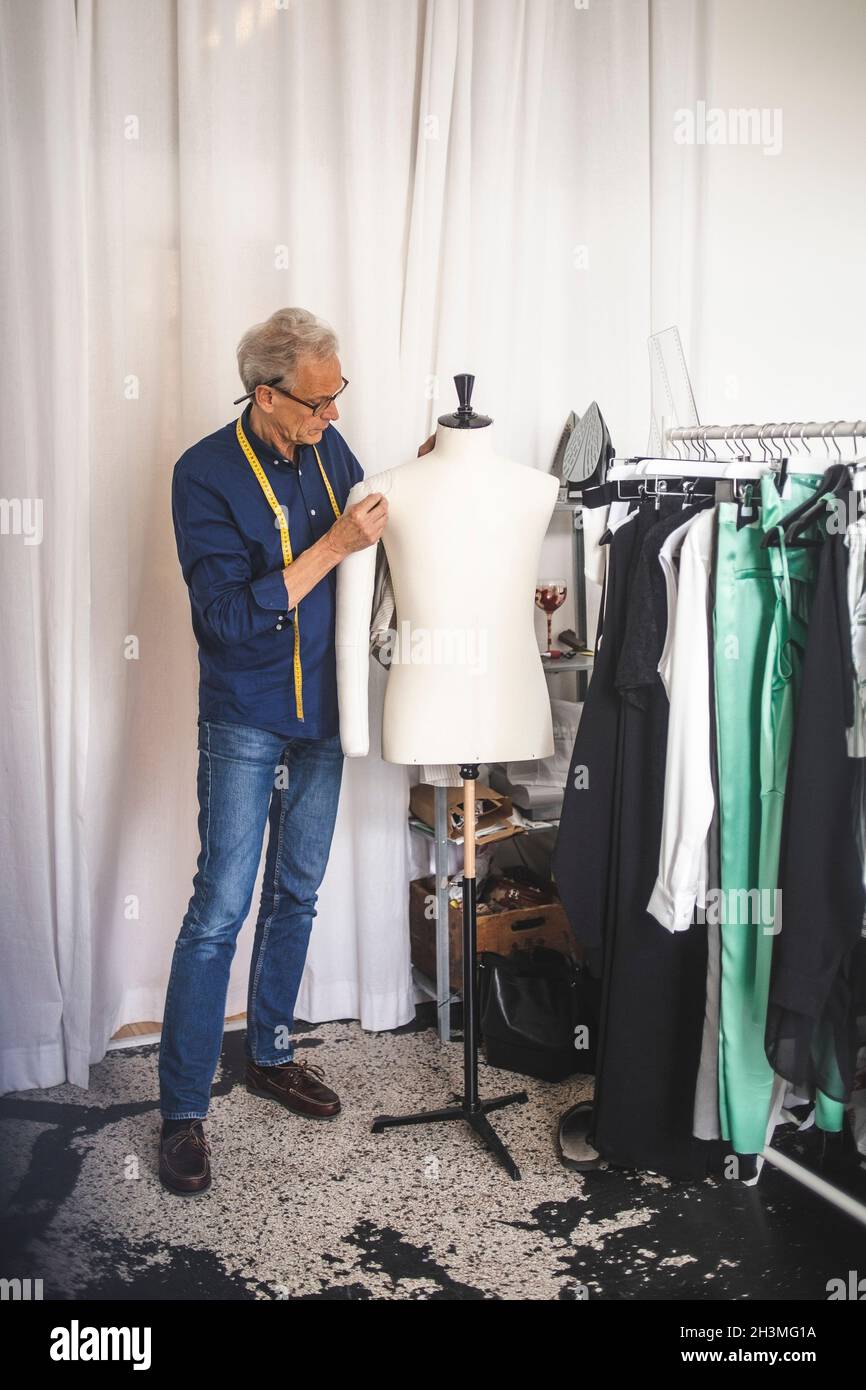 Senior male entrepreneur in clothing store Stock Photo