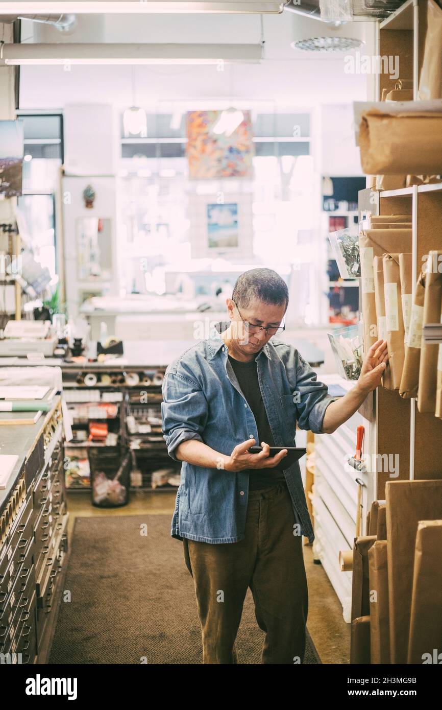 Male entrepreneur using digital tablet at office Stock Photo