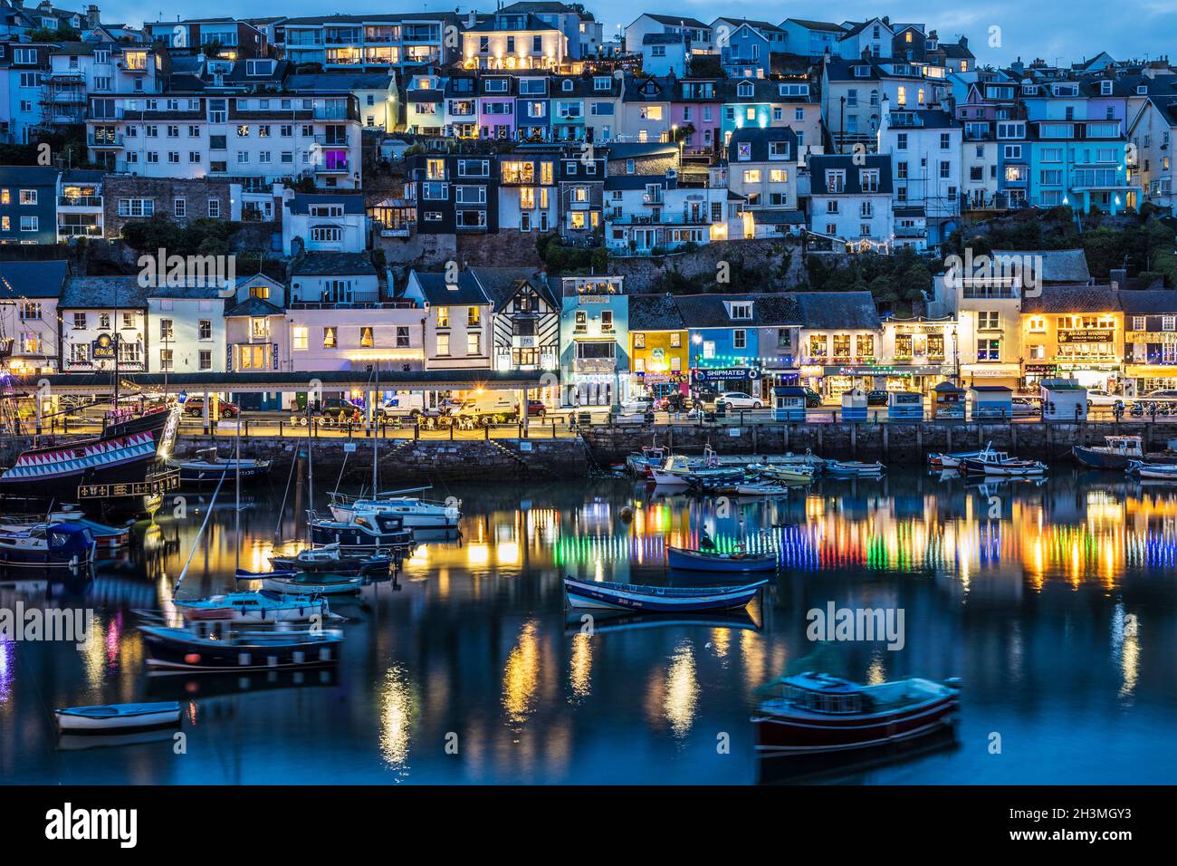 Brixham town and harbour at twilight. Stock Photo