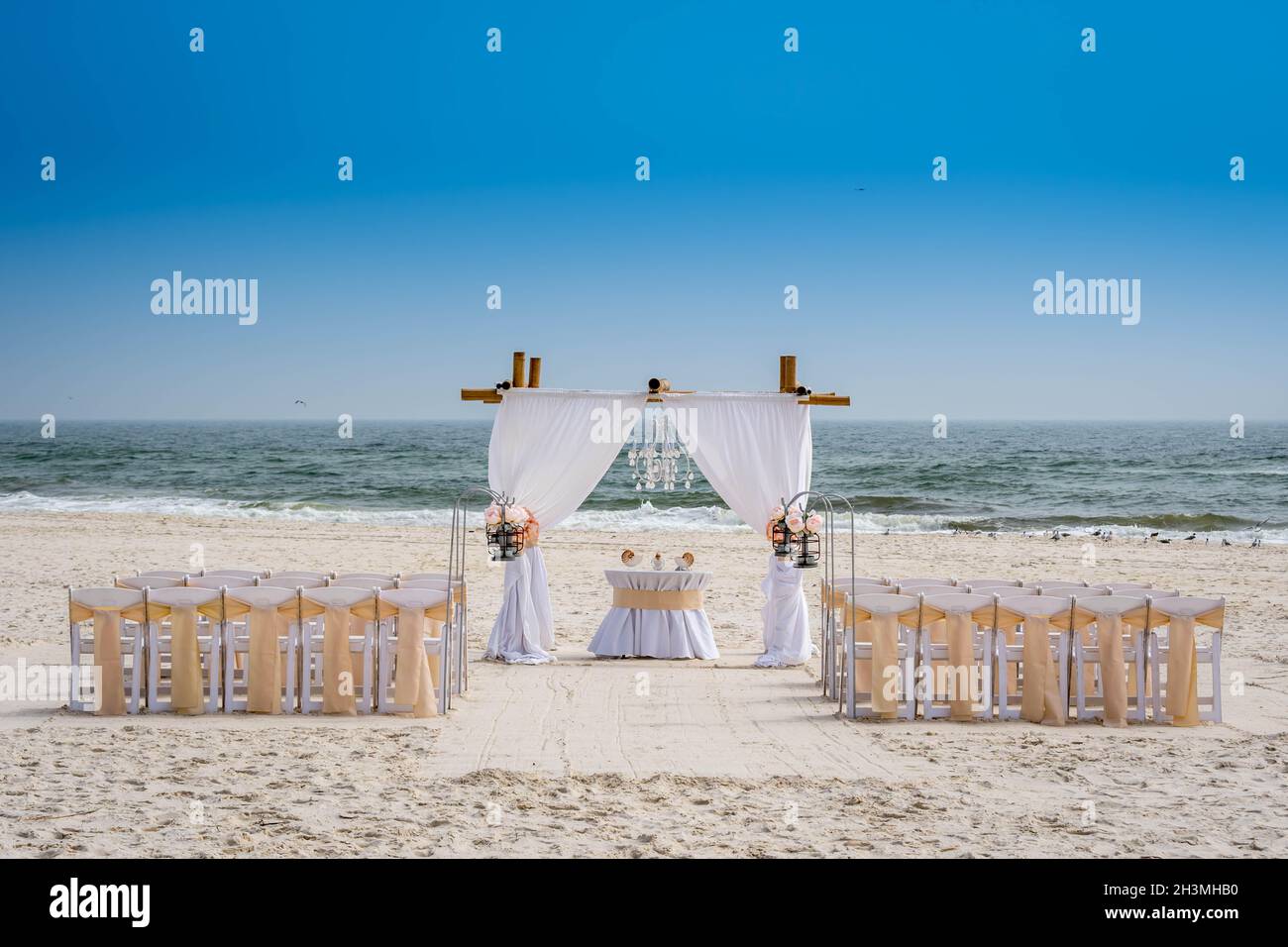 Natural wood arch frame for wedding on a sandy beach in Gulf Coast Stock Photo