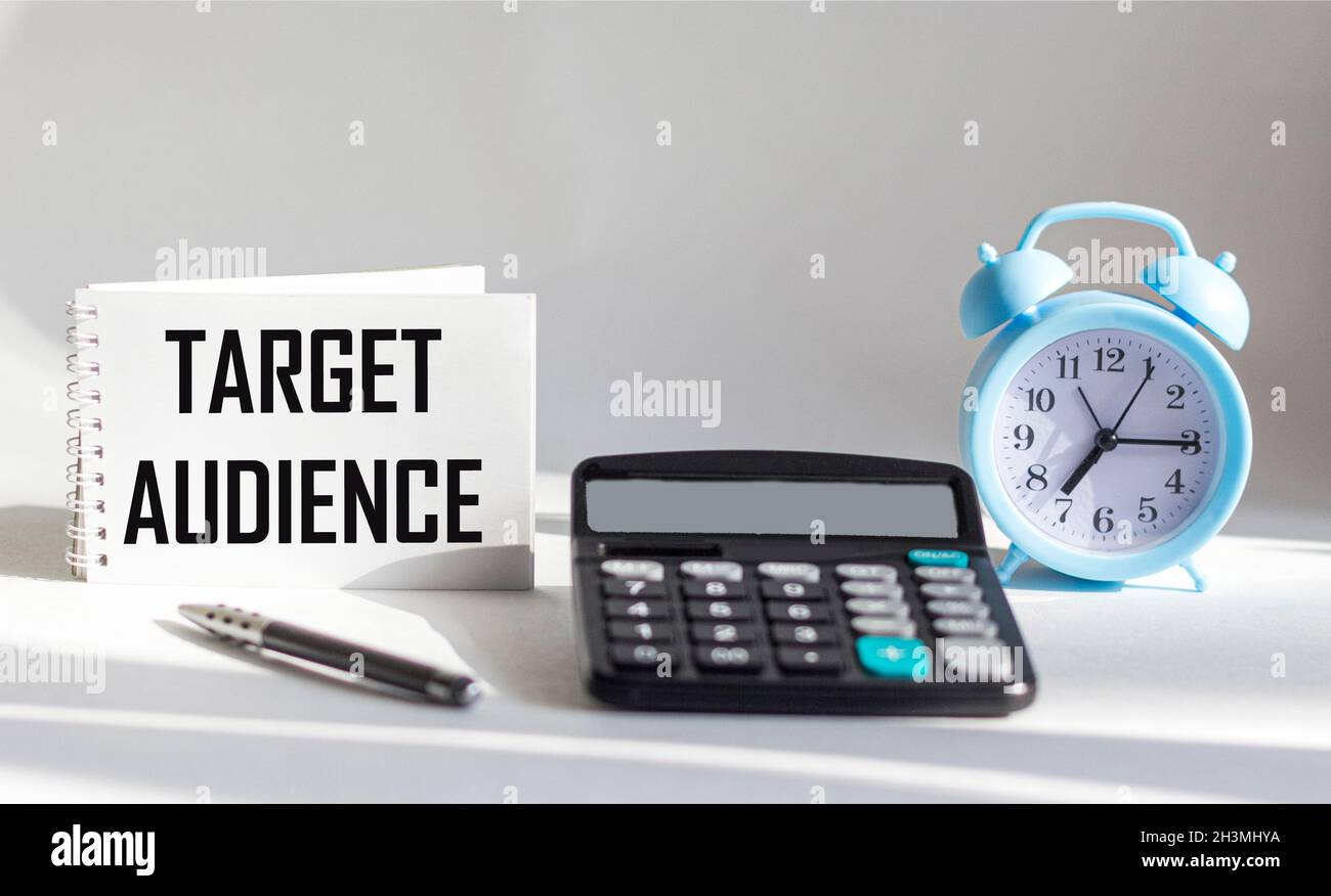 Notebook with target audience text with white background, calculator
