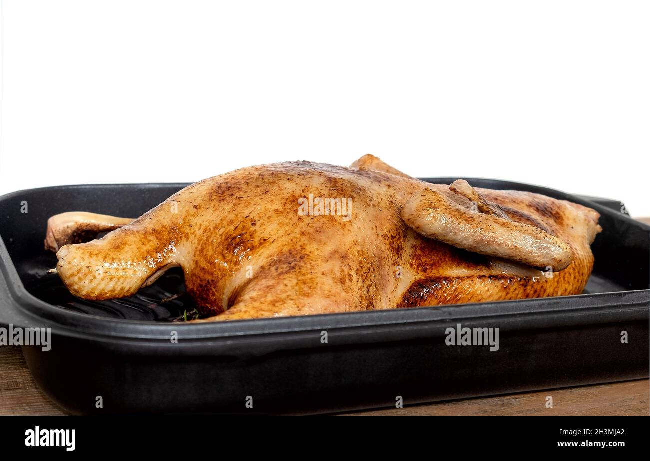 Whole roasted or slowly baked duck in roasting pan Stock Photo - Alamy