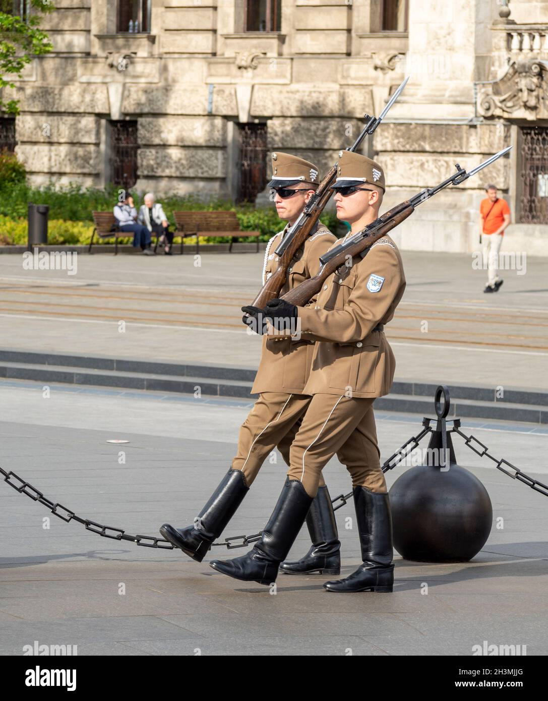 Two Soldiers Marchig: Two soldiers, on duty guarding the Hungarian Parliament march in unison with their weapons around Kossuth Lajos Ter. Stock Photo