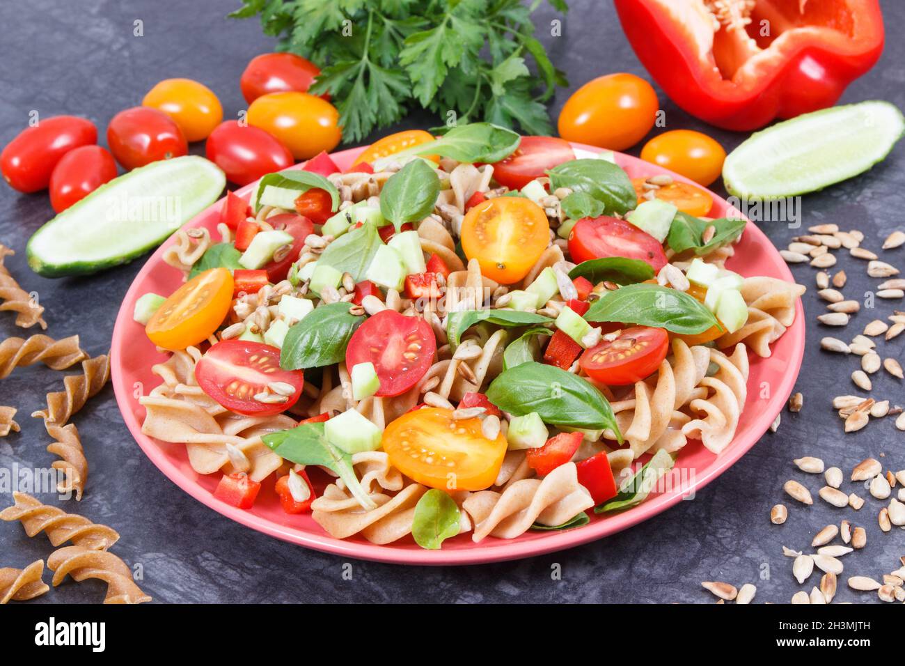 Fresh prepared salad with wholegrain pasta and vegetables as healthy