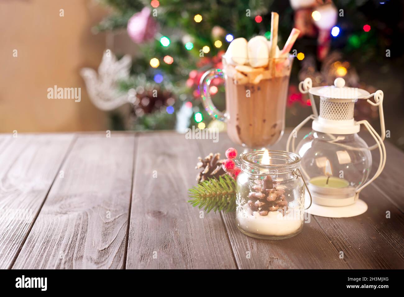 Christmas candles and ornaments over background with lights Stock Photo