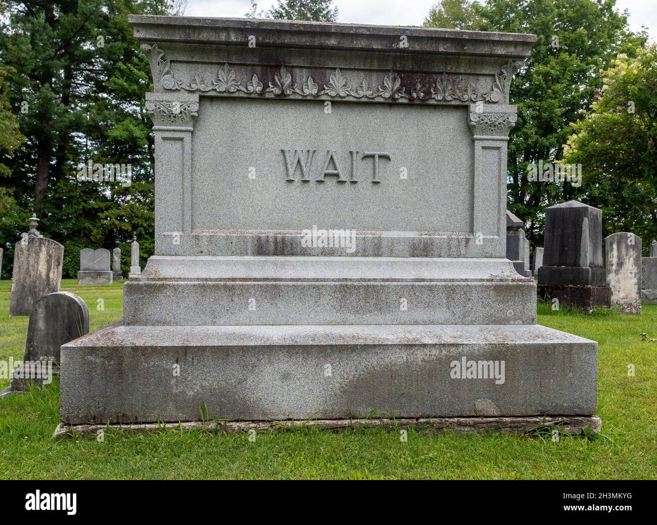 Wait Family Tombstone -- not yet...: A large stone memorial for the WAIT family. Seems to be a message for not being ready to die. Stock Photo