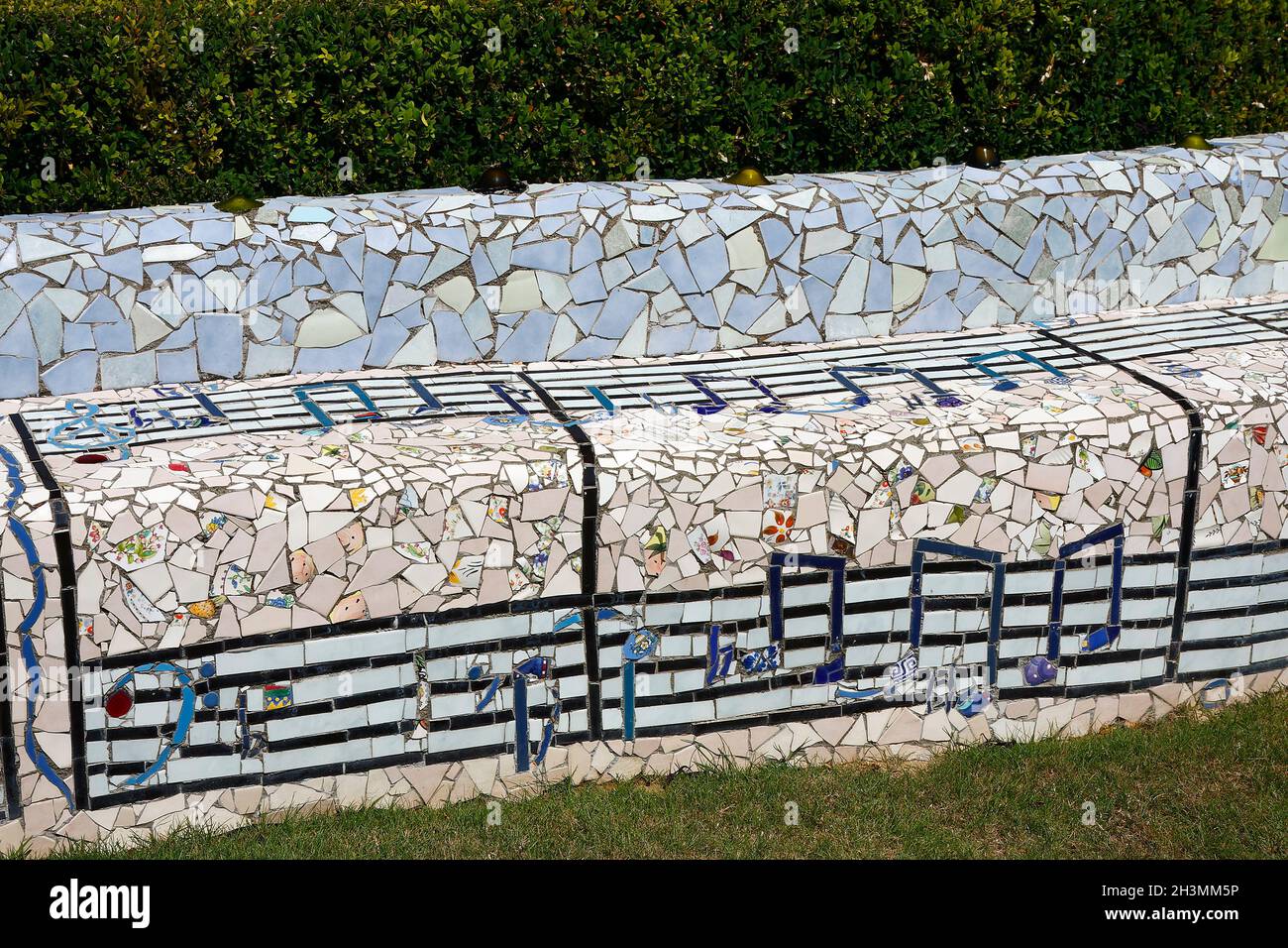 decorative bench sculpture; musical notes; colorful mosaic pieces; art, creative, unique, The Giants House, South Island, Akaroa; New Zealand Stock Photo