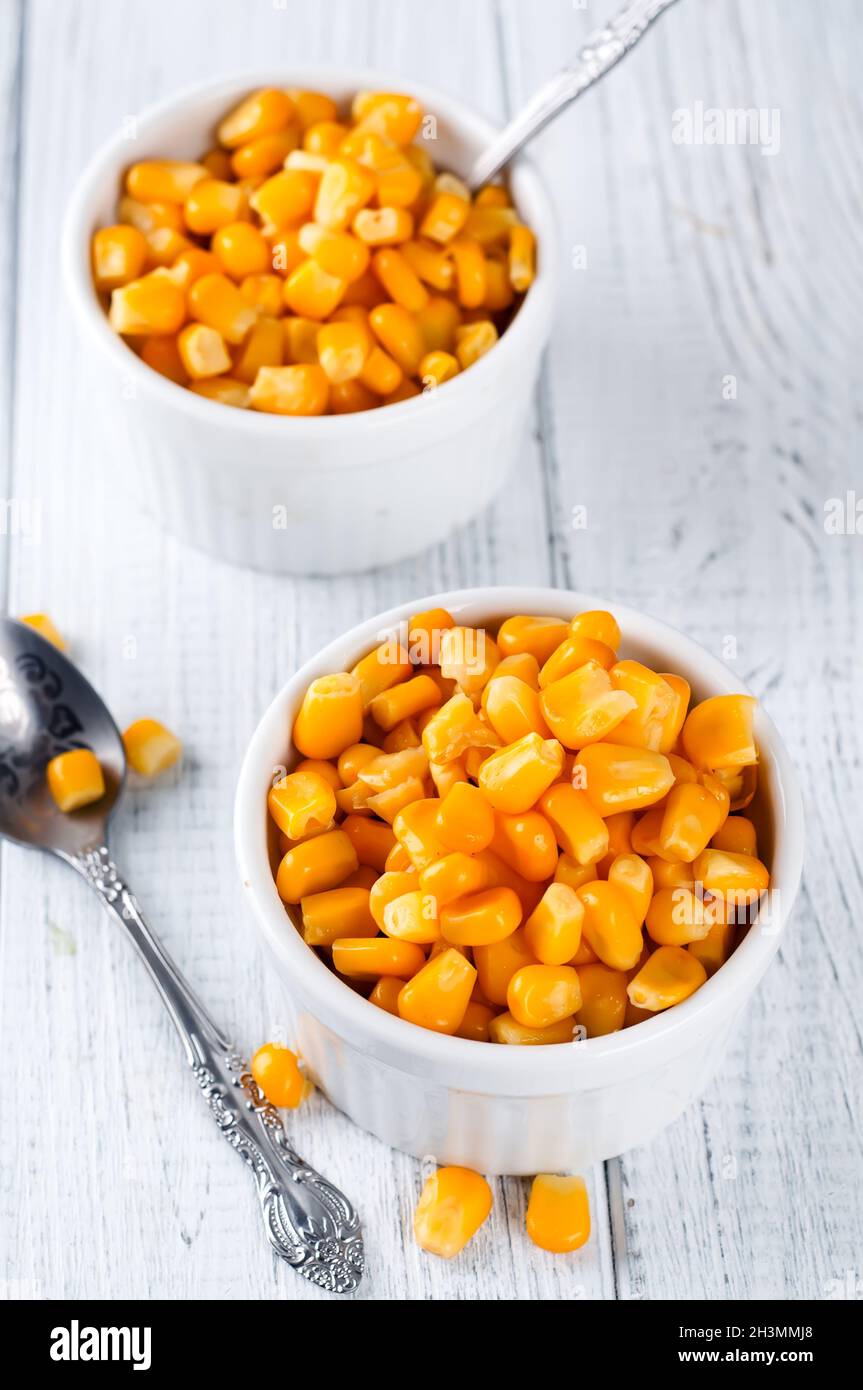 Boiled corn kernels in white cups Stock Photo Alamy