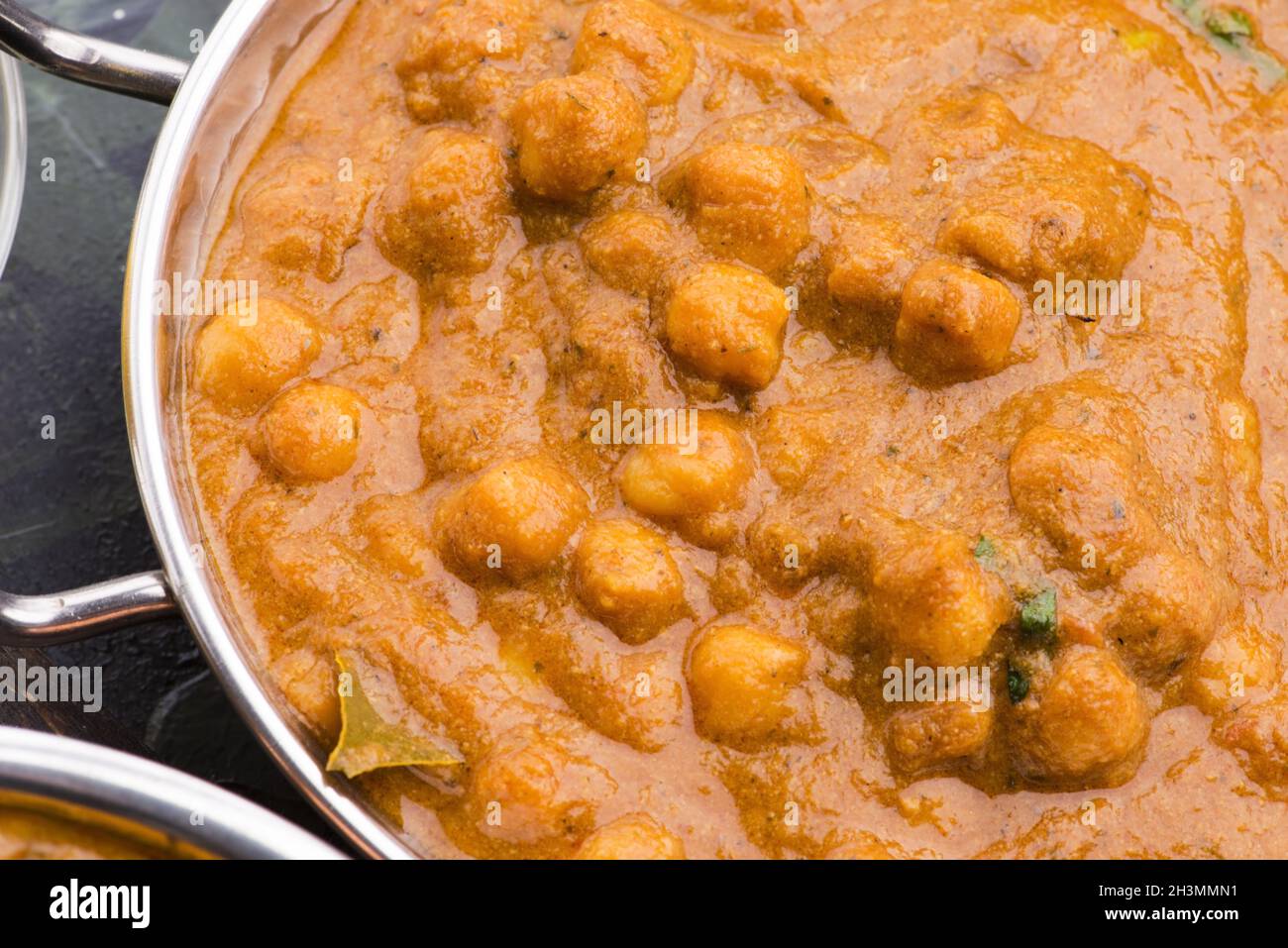 Chana Masala Traditional Indian dish with chickpeas and curry Stock