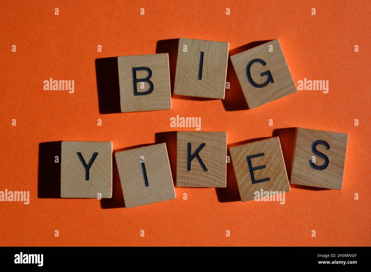 Big Yikes, words in wooden alphabet letters isolated on orange