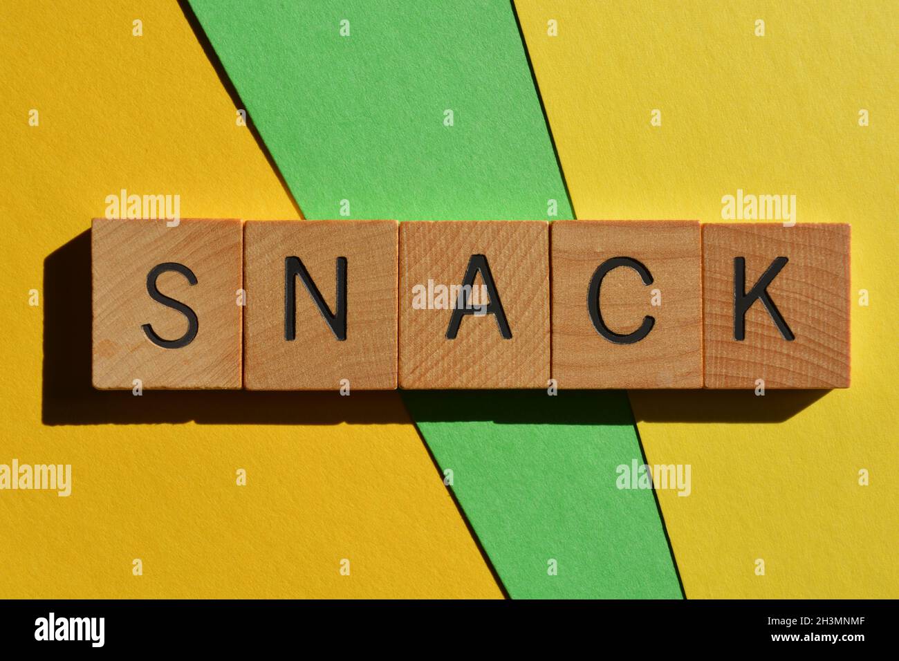 Snack, word in wooden alphabet letters, a Generation Z slang word used