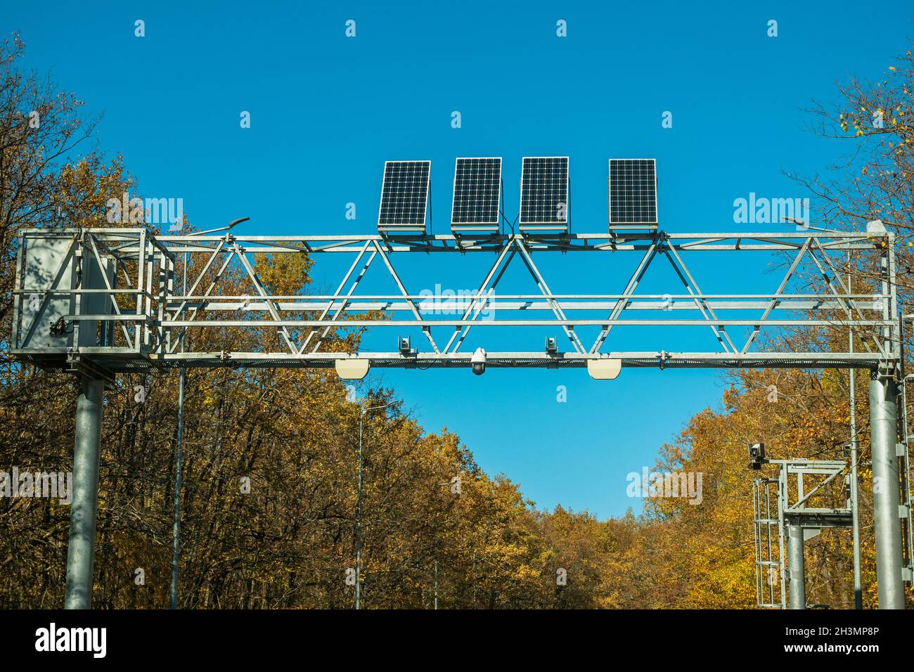 Weight control post with cameras fixing speed and weights. Solar panels are installed on the structure of the post. The concept of safety on the roads Stock Photo