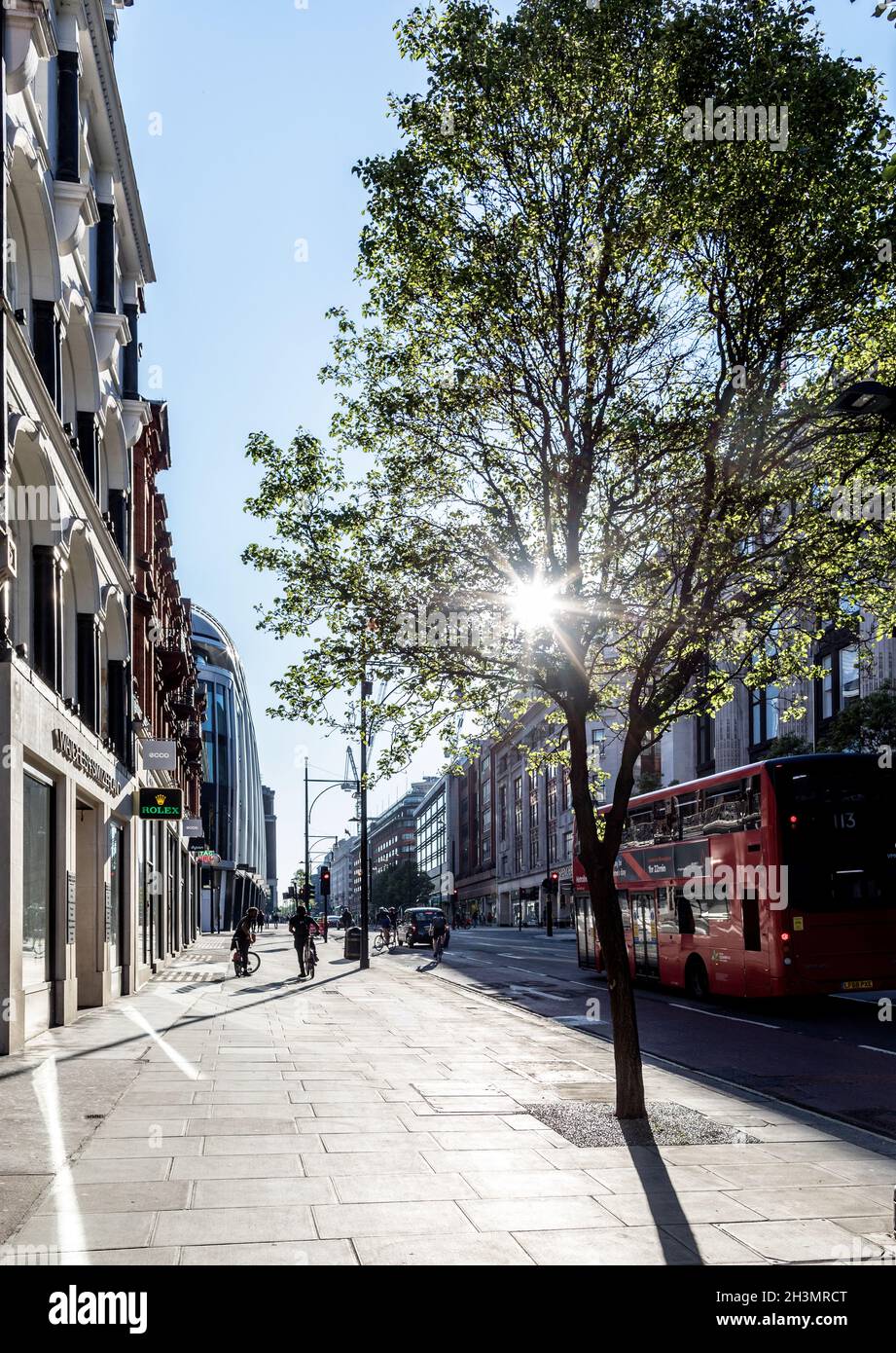 People Walking Along Oxford Street in Summer London UK Stock Photo