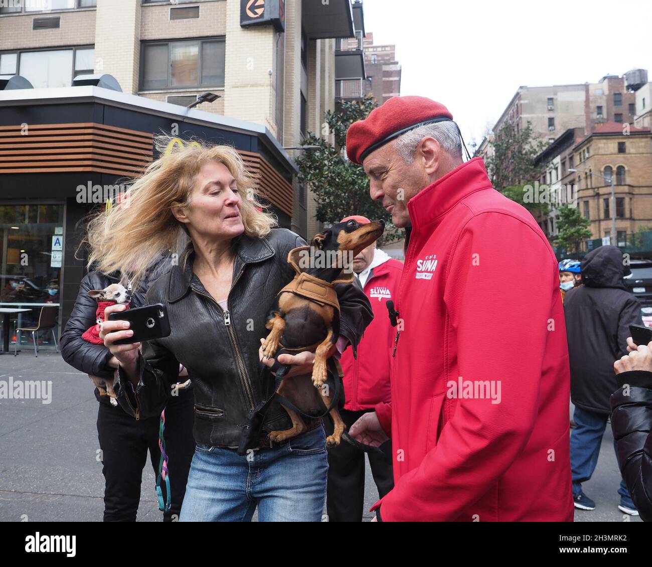 New York, USA. 29th Oct, 2021. A woman and her Chihuahua greet Mayoral