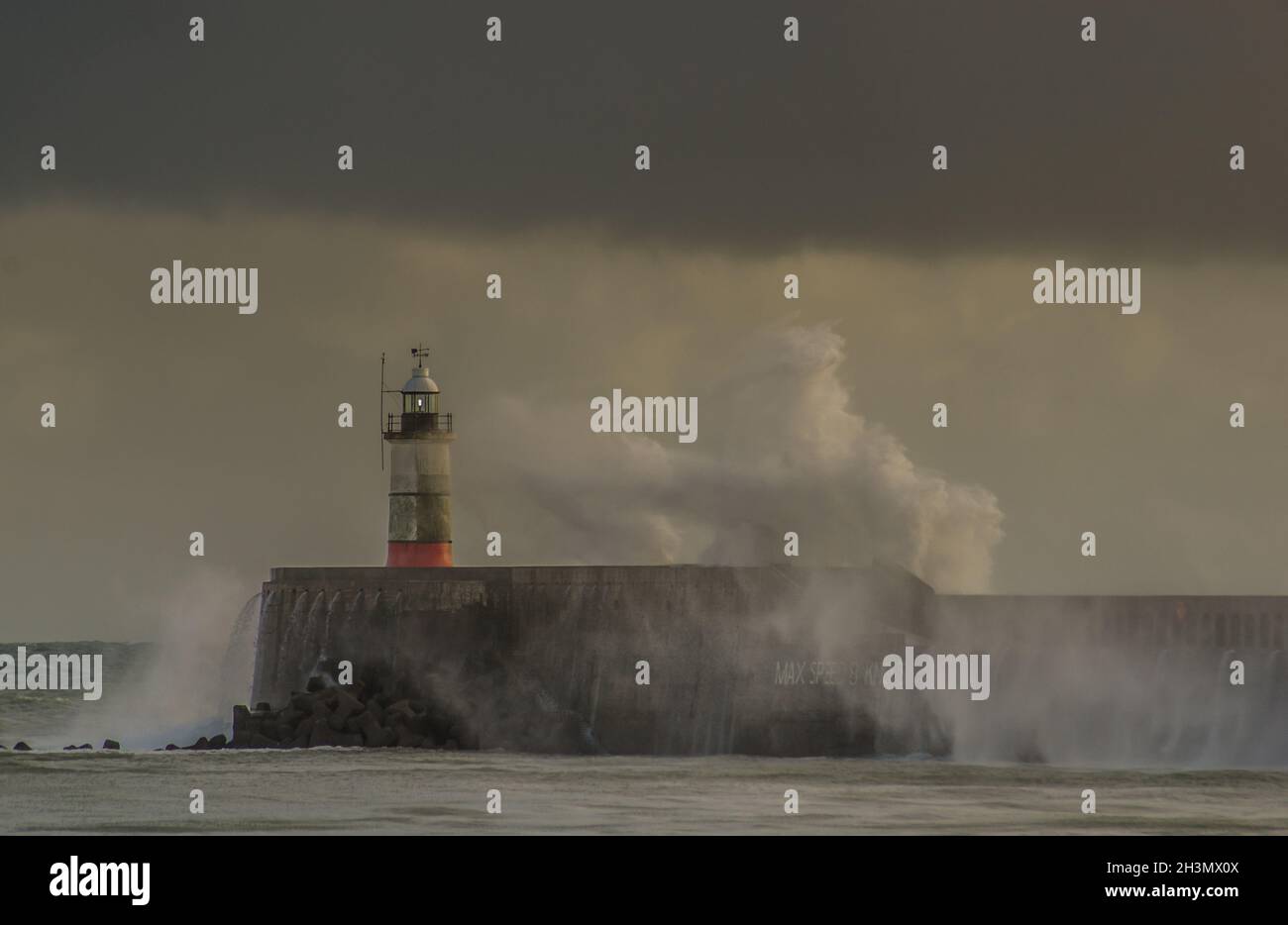 Newhaven, East Sussex, UK. 29th Oct, 2021. A strong South Westerly wind whips up the waves along the South coast creating some spectacular scenes particularly when the sunlight breaks through the heavy cloud cover. Still warm at 15 degrees temperatures are forecast to fall in the next week with more heavy rain. Credit: David Burr/Alamy Live News Stock Photo