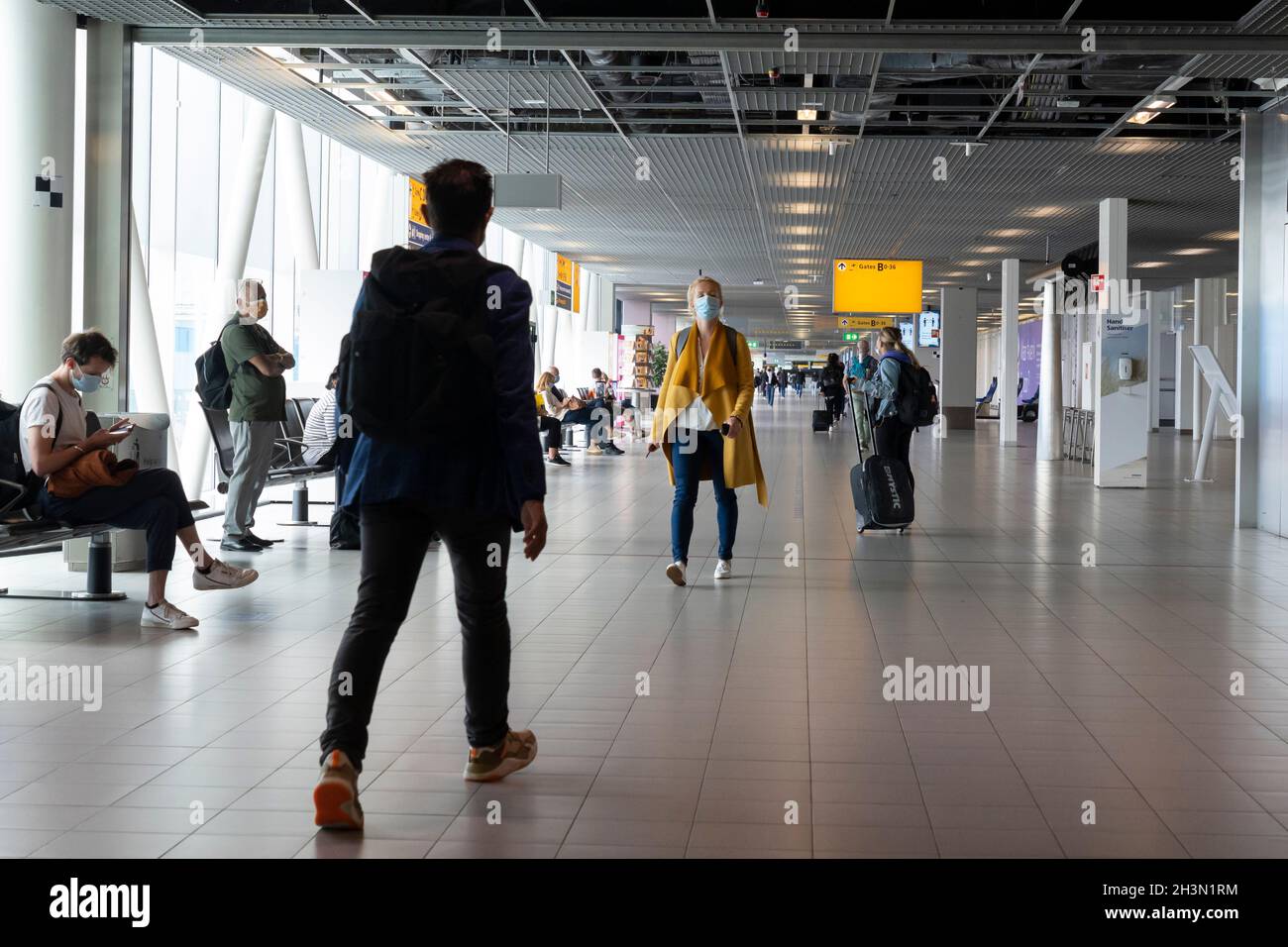 Passengers at Concourse B in Amsterdam Airport Schiphol, the Netherlands. Stock Photo