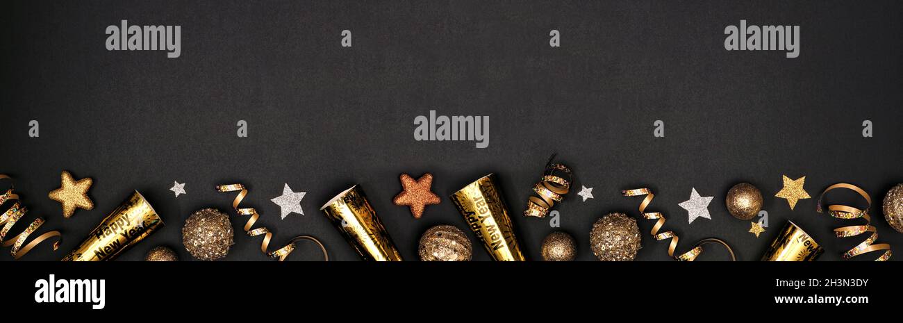 New Years Eve border banner of glittery gold stars, streamers ...