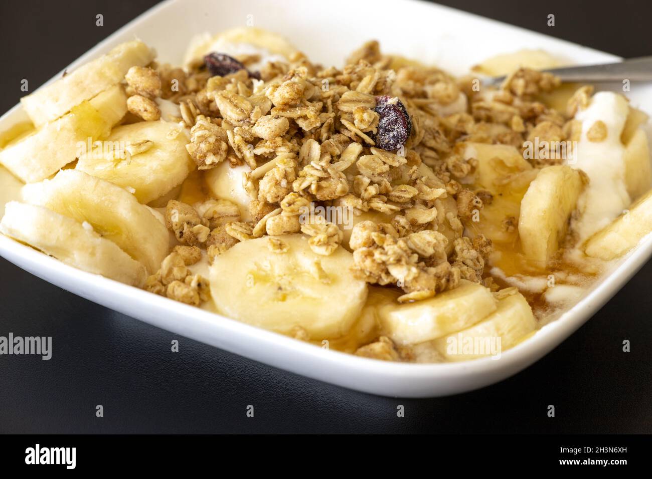 Yoghurt with banana slices Stock Photo