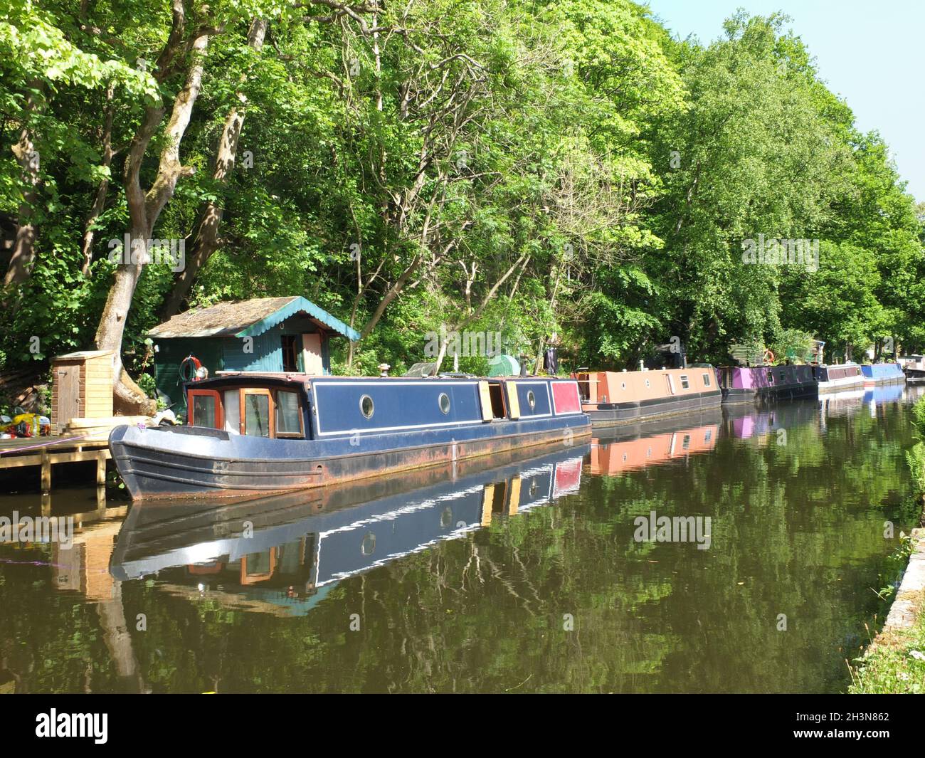 Old canal boats moored on the rochdale canal near hebden bridge