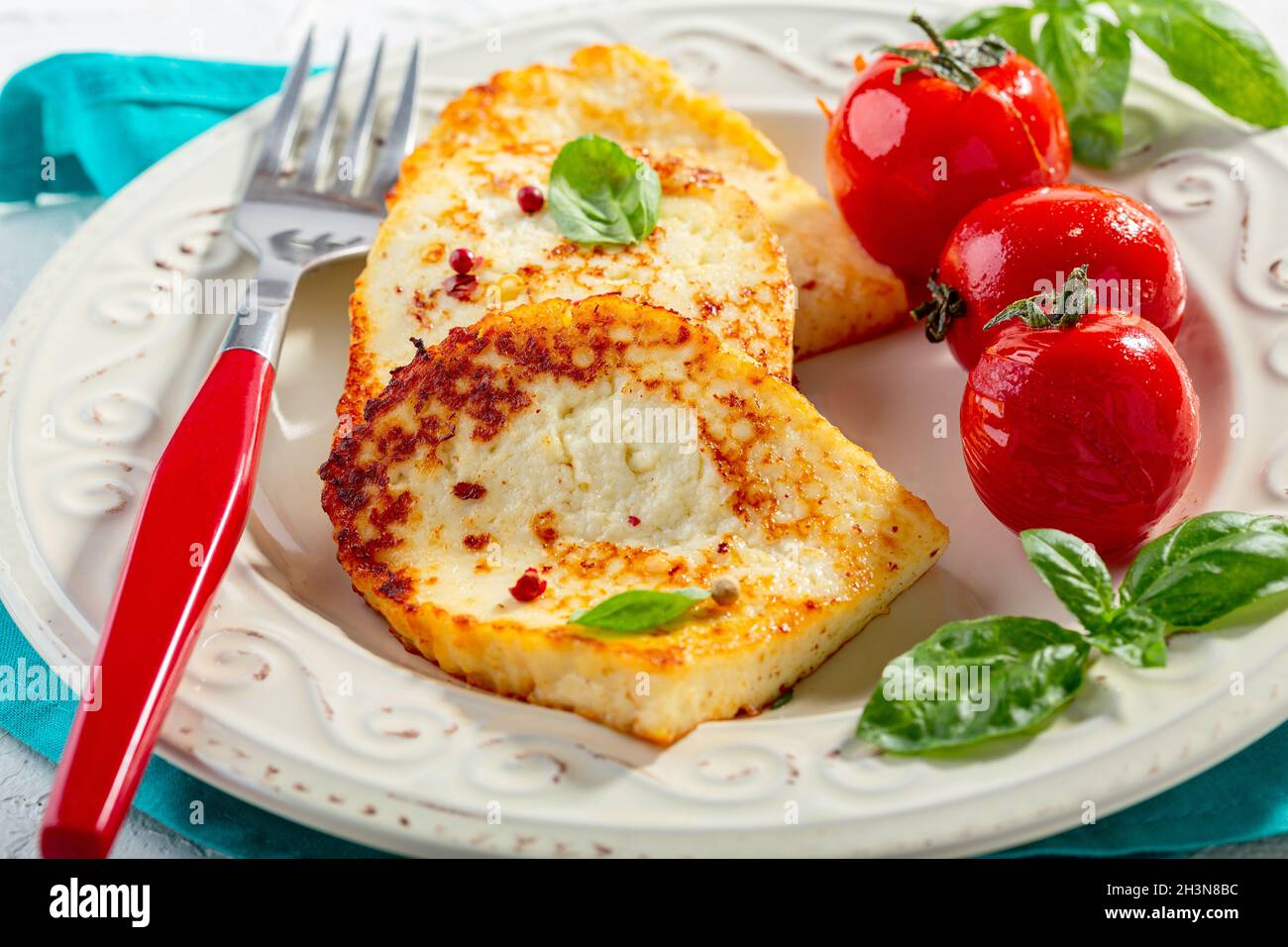 Grilled traditional halloumi cheese. Stock Photo