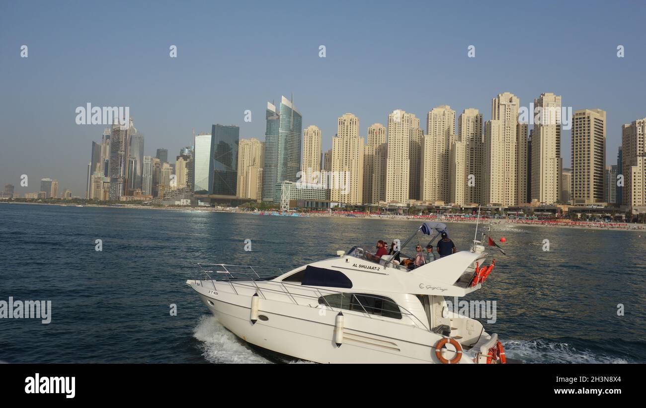 Luxury Yacht navigating in Dubai sea. Stock Photo