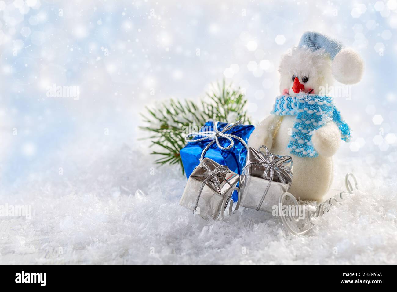 Festive Christmas card with a snowman. Stock Photo