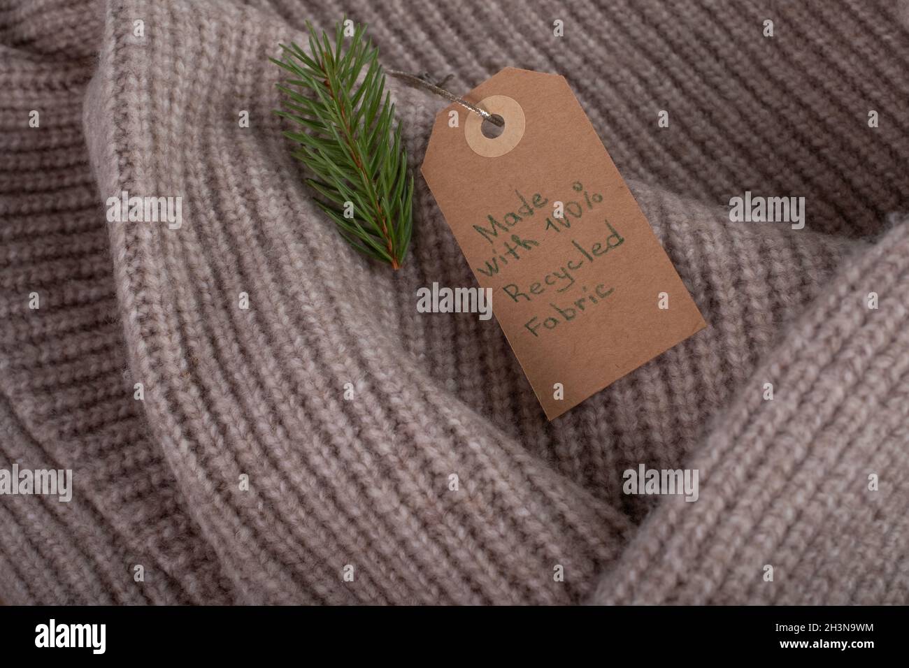 Label made with recycled fabric and decorated with a Christmas tree ...