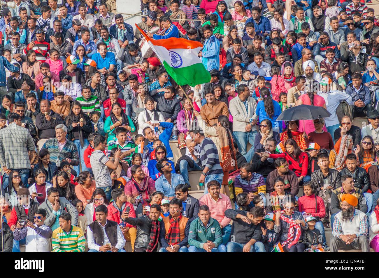 WAGAH, INDIA - JANUARY 26, 2017: Indian spectators watch the military ceremony at India-Pakistan border in Wagah in Punjab, India. Stock Photo