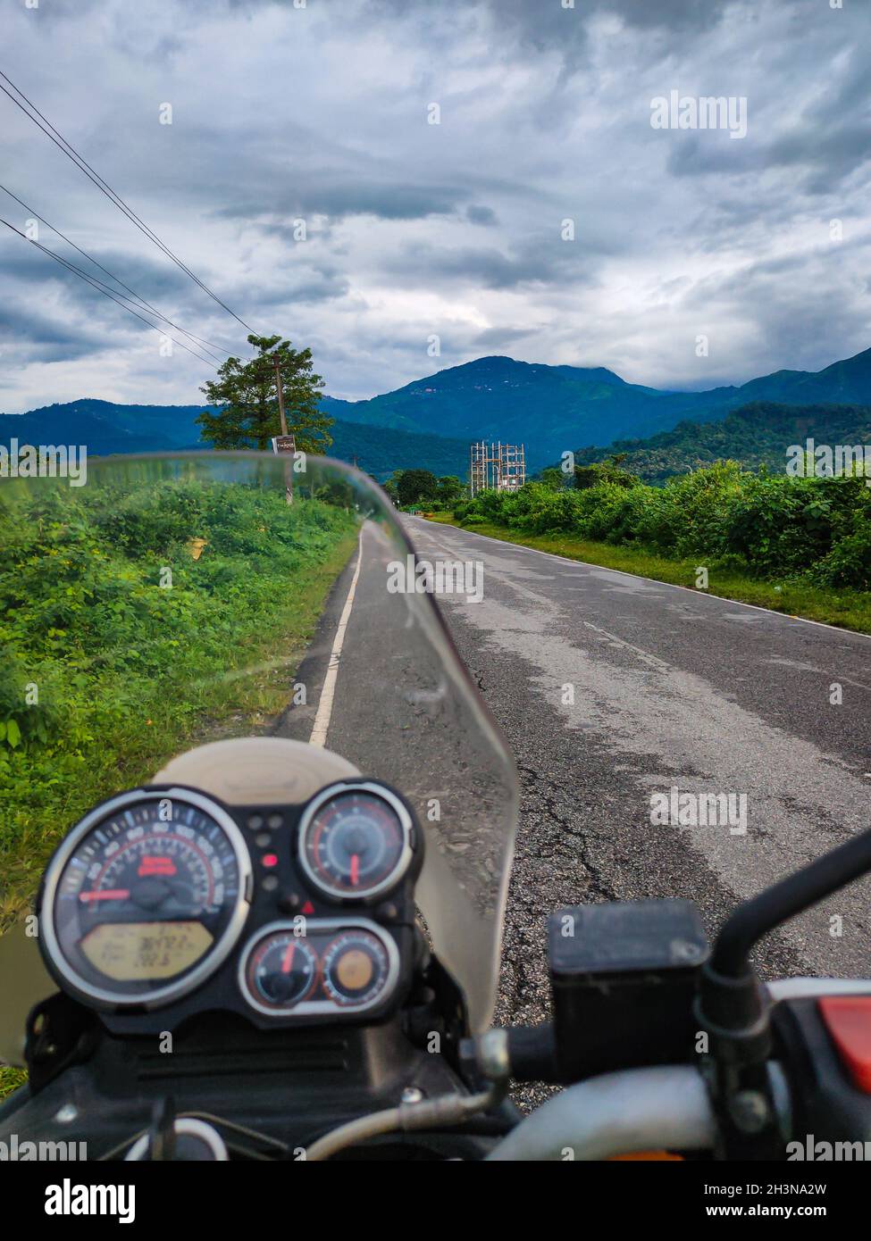 motorcycle front view at tarmac road with mountain view at morning Stock Photo
