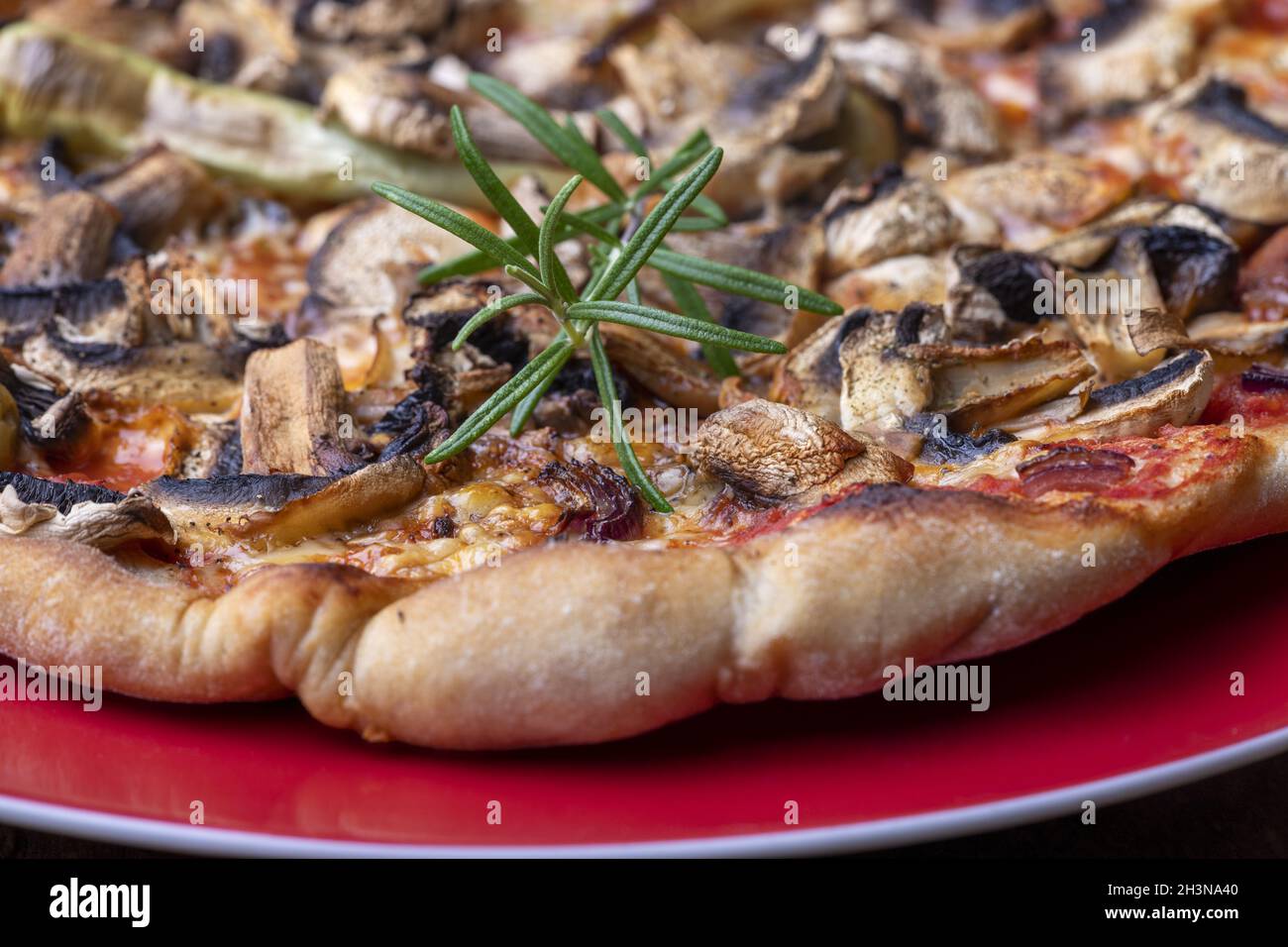 Rosemary on a pizza Stock Photo Alamy