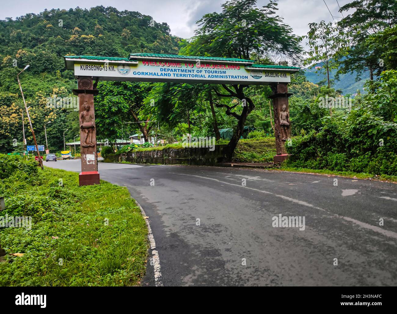 city entry gate with leading tarmac road at morning from flat angle image is taken at darjeeling west bengal india on Sep 18 2021. Stock Photo
