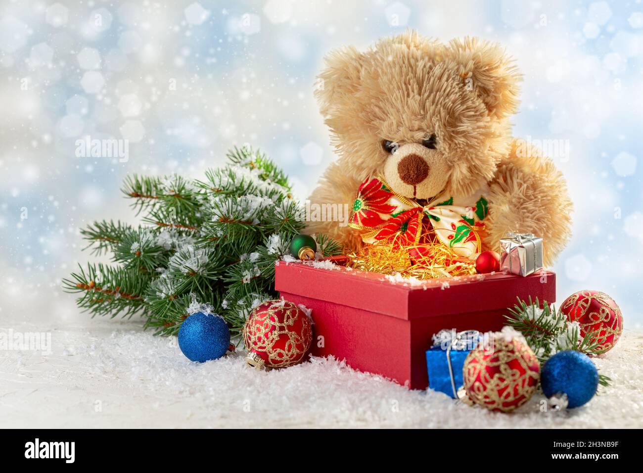 Merry Christmas gift box and soft toy bear greeting card. Stock Photo