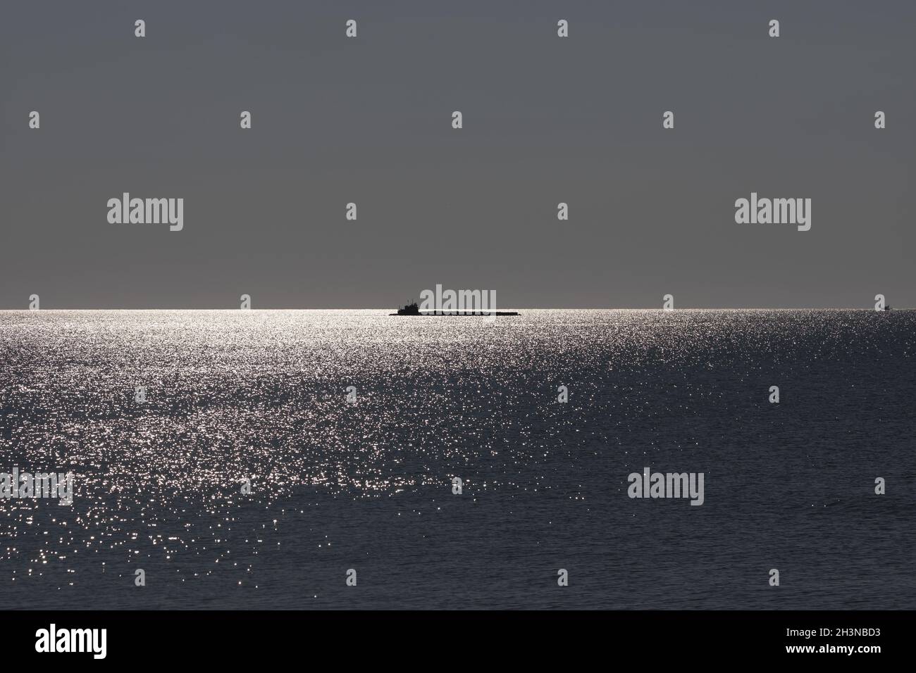Lake Michigan with a cargo ship on the horizon Stock Photo Alamy