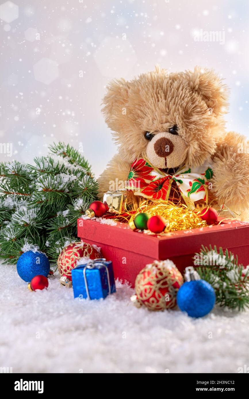 Merry Christmas gift box and soft toy bear greeting card. Stock Photo