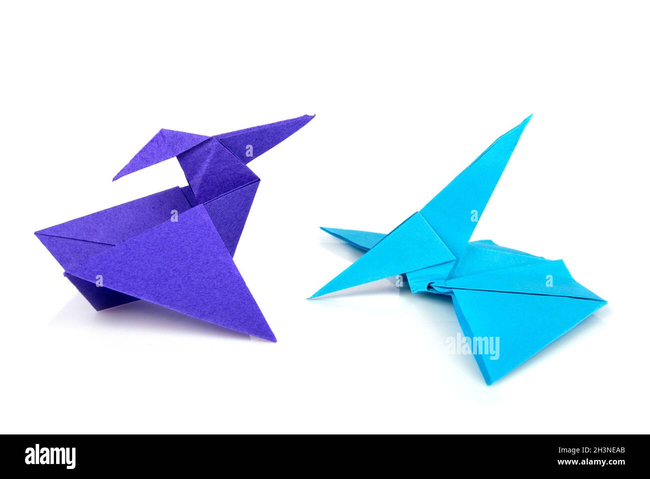 Colored origami paper pterodactyls over white background Stock Photo ...