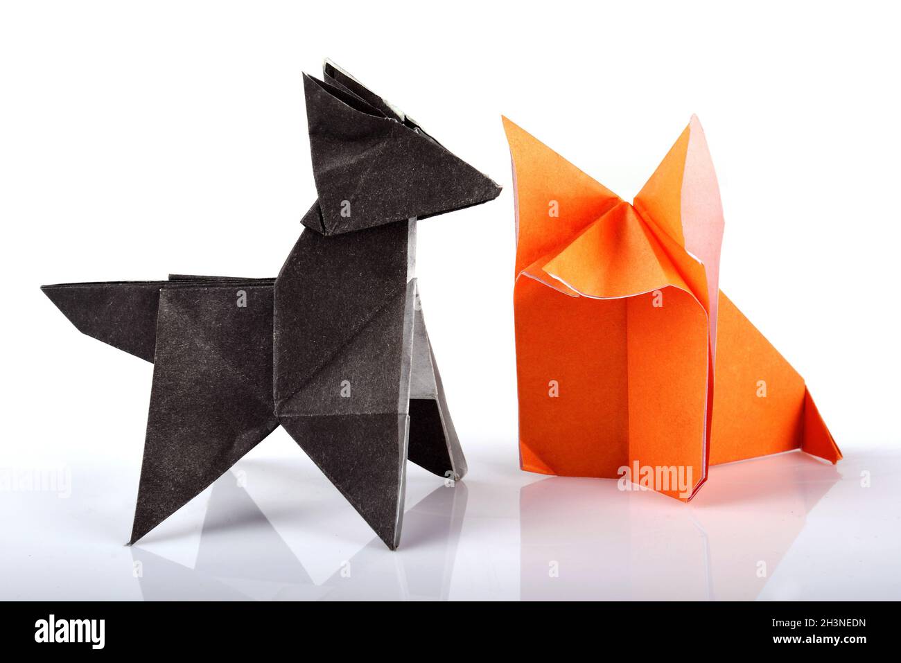 Origami paper wolf and fox isolated over white background Stock Photo