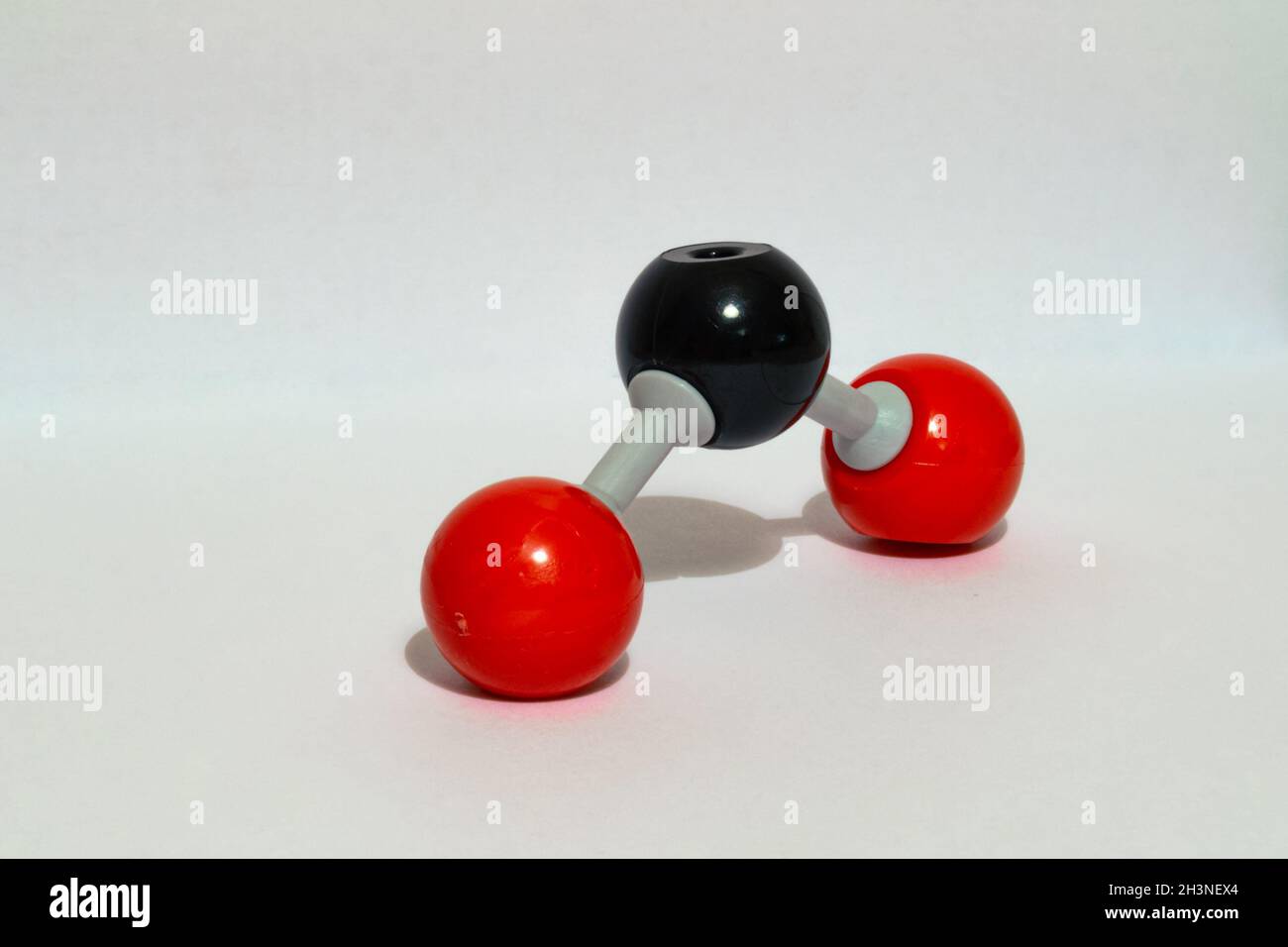 Model of carbon dioxide (CO2) molecule, responsible for heating of the atmosphere and climate change. Used in chemistry class. Stock Photo