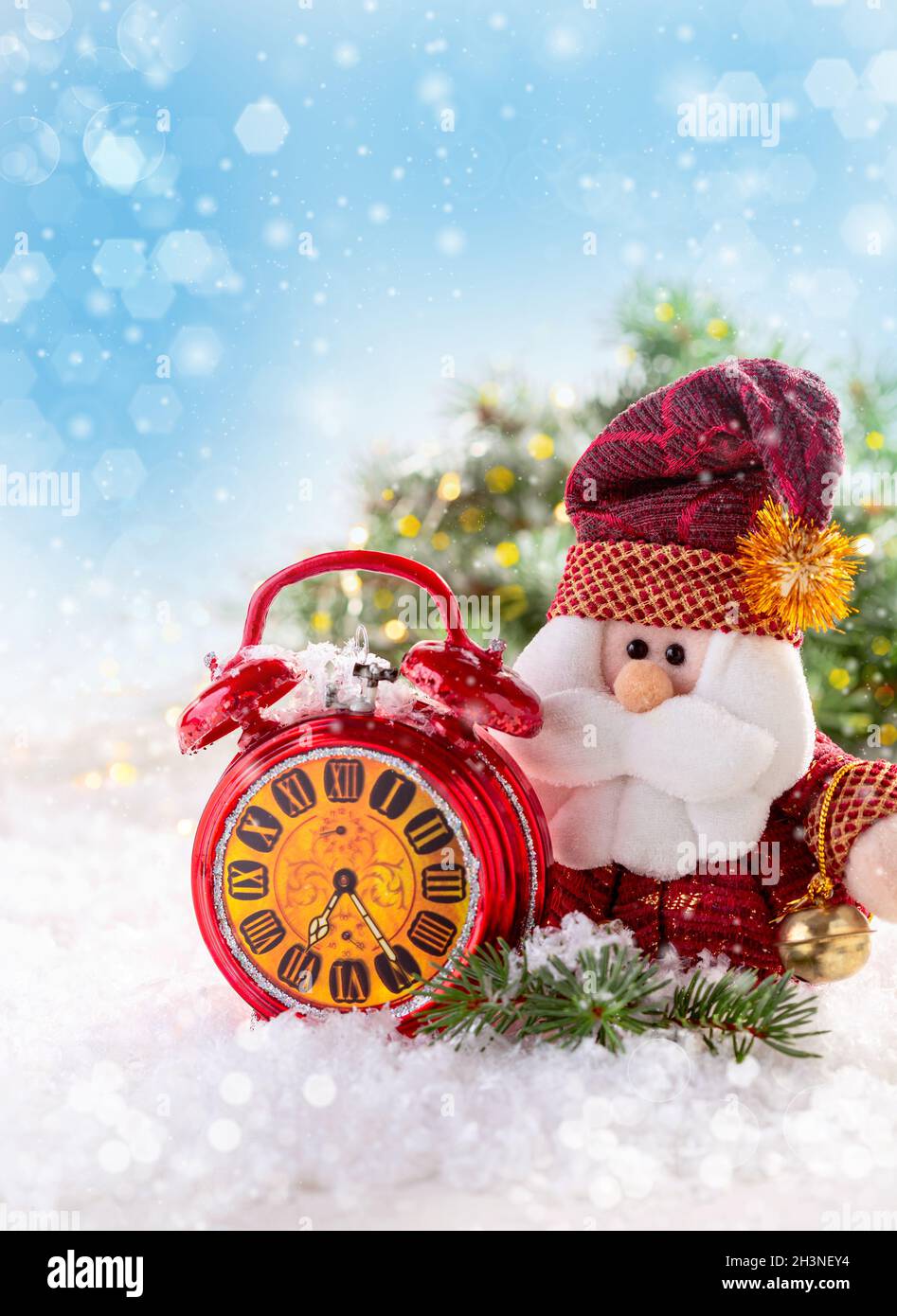Greeting card with Santa Claus and red alarm clock. Stock Photo