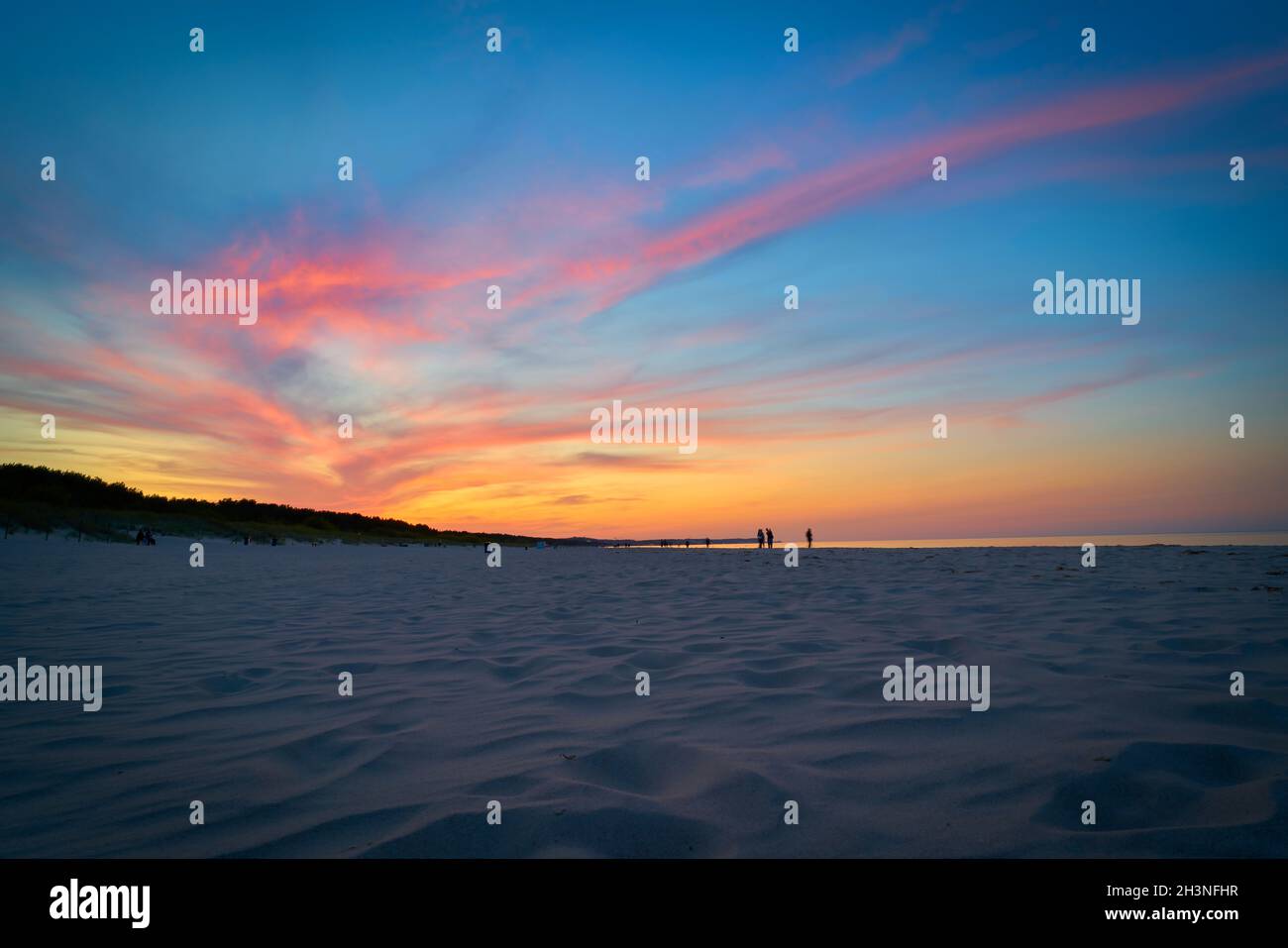 Atmospheric sky after a sunset on the beach of Swinoujscie in Poland Stock Photo