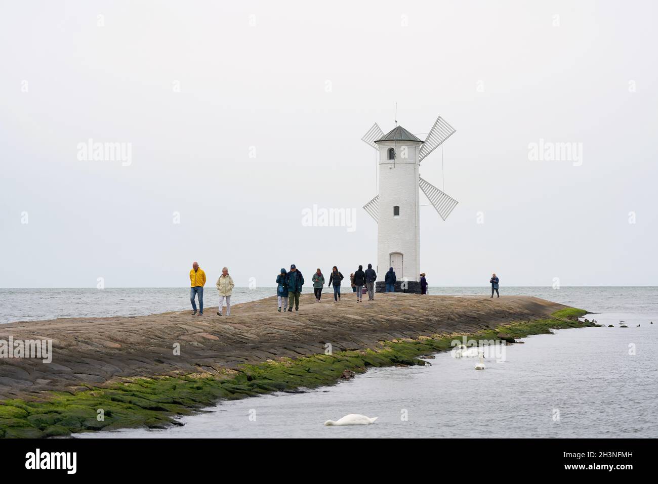 Holidaymakers at the MÃ¼hlenbake, the landmark of Swinoujscie on the Polish Baltic coast Stock Photo