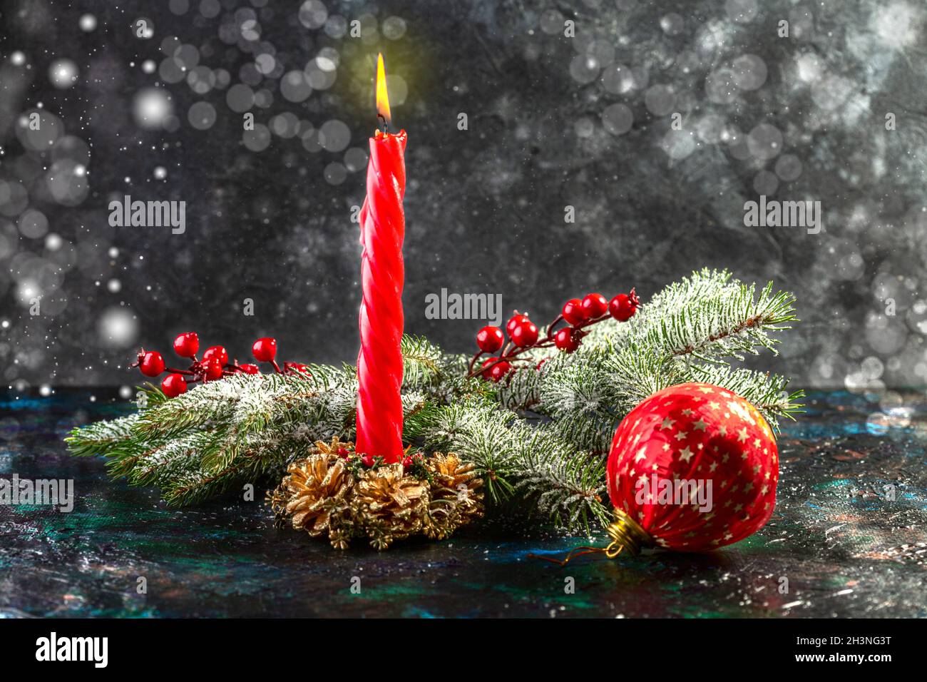 Christmas candle with fir branches. Stock Photo