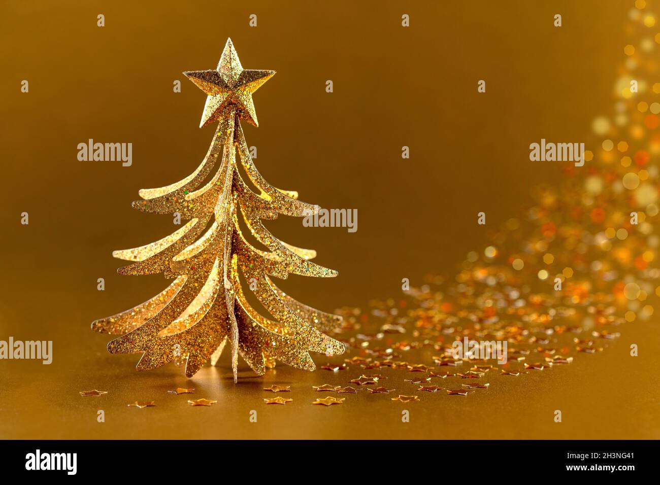 Festive golden Christmas tree. Stock Photo