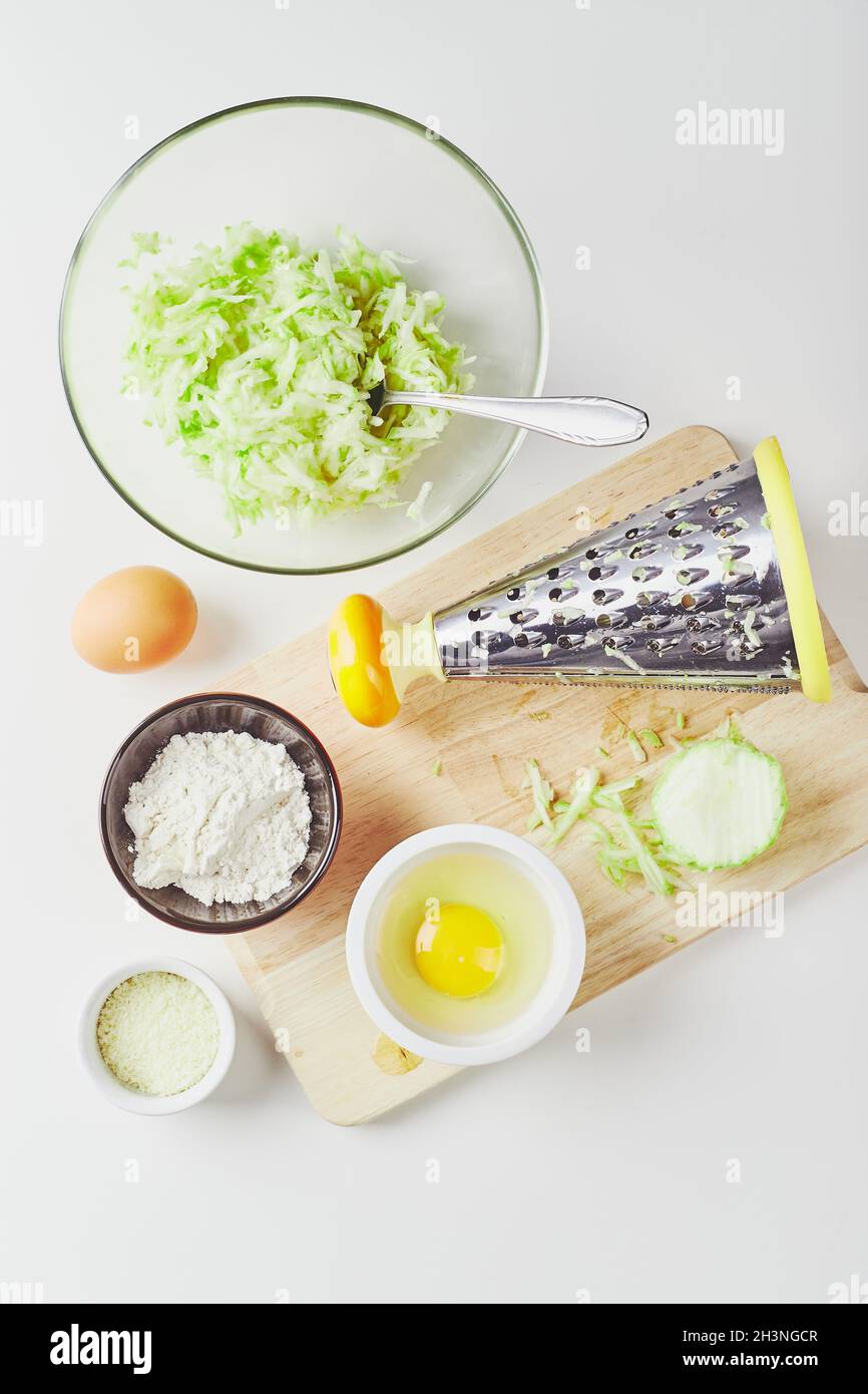 Ingredients for cooking zucchini pancakes Stock Photo Alamy