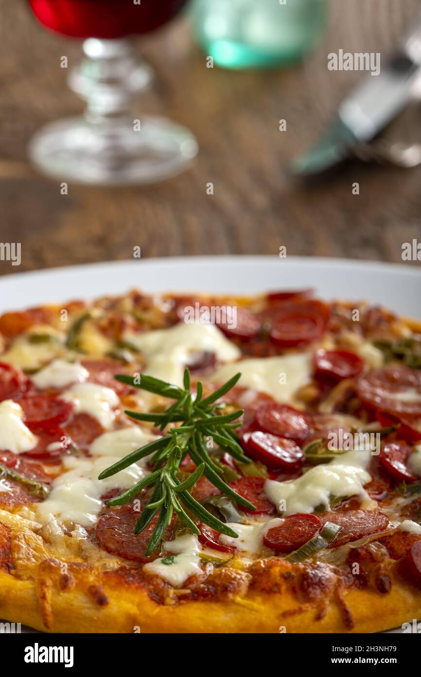Rosemary on a pizza Stock Photo Alamy