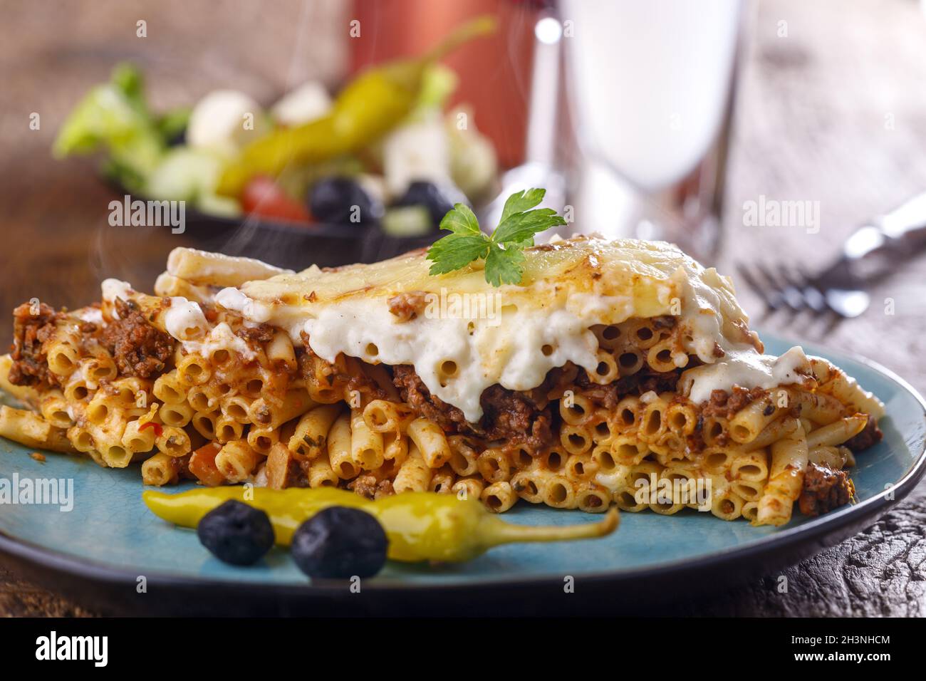 Greek pastitsio on a blue plate Stock Photo